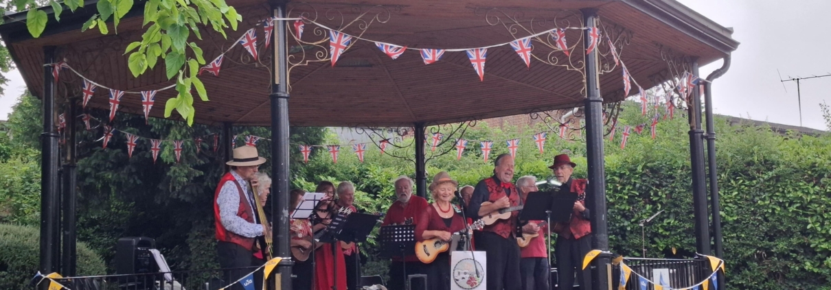 Saffron Walden band stand with a band playing music