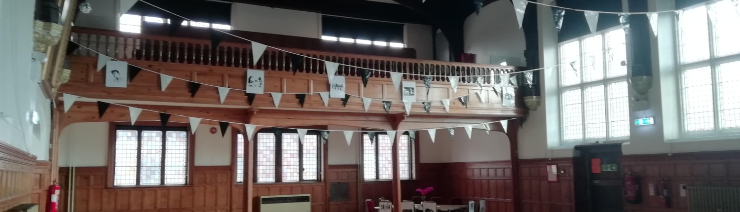a picture of the inside of the town hall with bunting