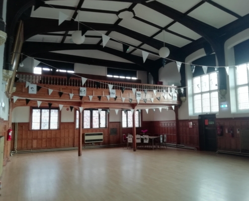 a picture of the inside of the town hall with bunting