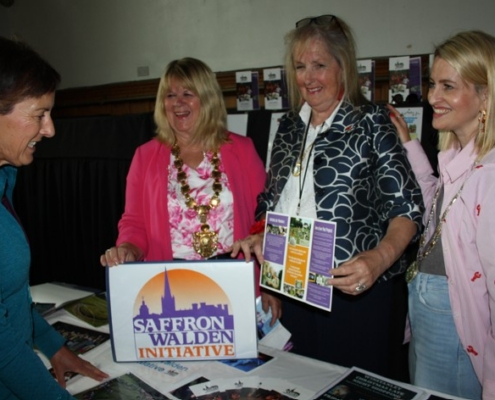 Mayor and Deputy Mayor chatting to stall holders at the Volunteer Recruitment Fair